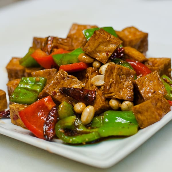 Kung Pao Tofu from Go China Restaurant, with bell peppers, peanuts, and chili peppers.